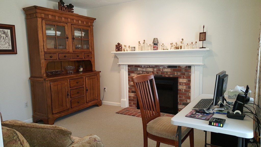 5 Hazen Road Shirley, MA 01464 - Photo 7 of 23 a living room with furniture and a fireplace