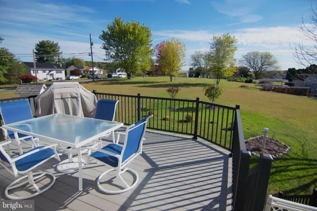 a view of a patio with wooden floor