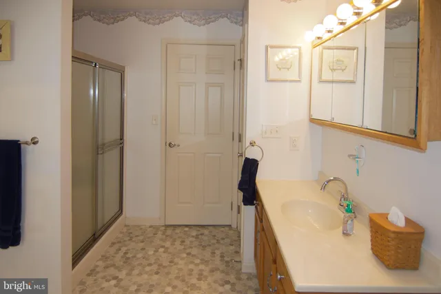 a bathroom with a tub and a shower