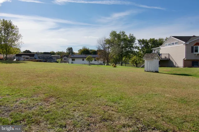 a view of a tiny house with a yard