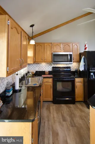 a kitchen with a stove and a sink