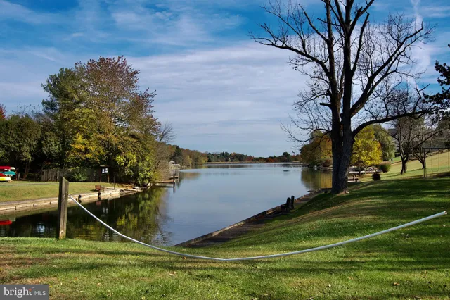 a view of a lake with a car parked
