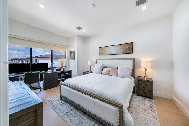 a view of walk in closet with clothes