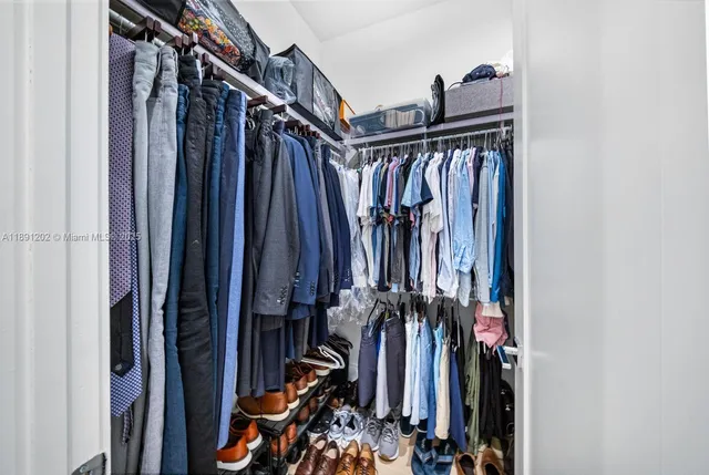 a large bathroom with a double vanity sink a mirror and a shower