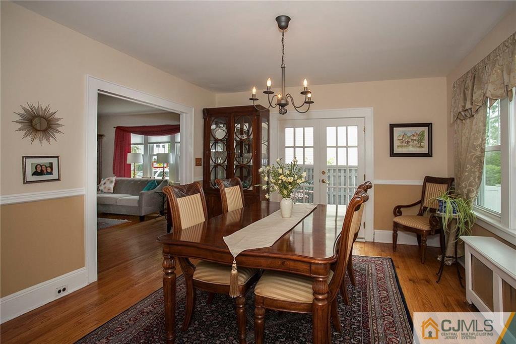 9 Lenox Street Edison, NJ 08817 - Photo 12 of 23 a view of a dining room with furniture a chandelier and wooden floor