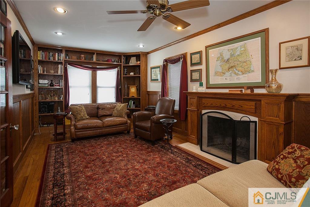 9 Lenox Street Edison, NJ 08817 - Photo 15 of 23 a living room with furniture a large window and a fireplace