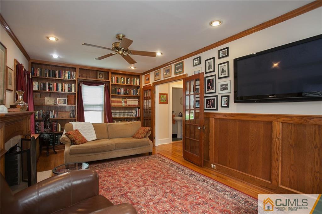 9 Lenox Street Edison, NJ 08817 - Photo 16 of 23 a living room with furniture and a flat screen tv
