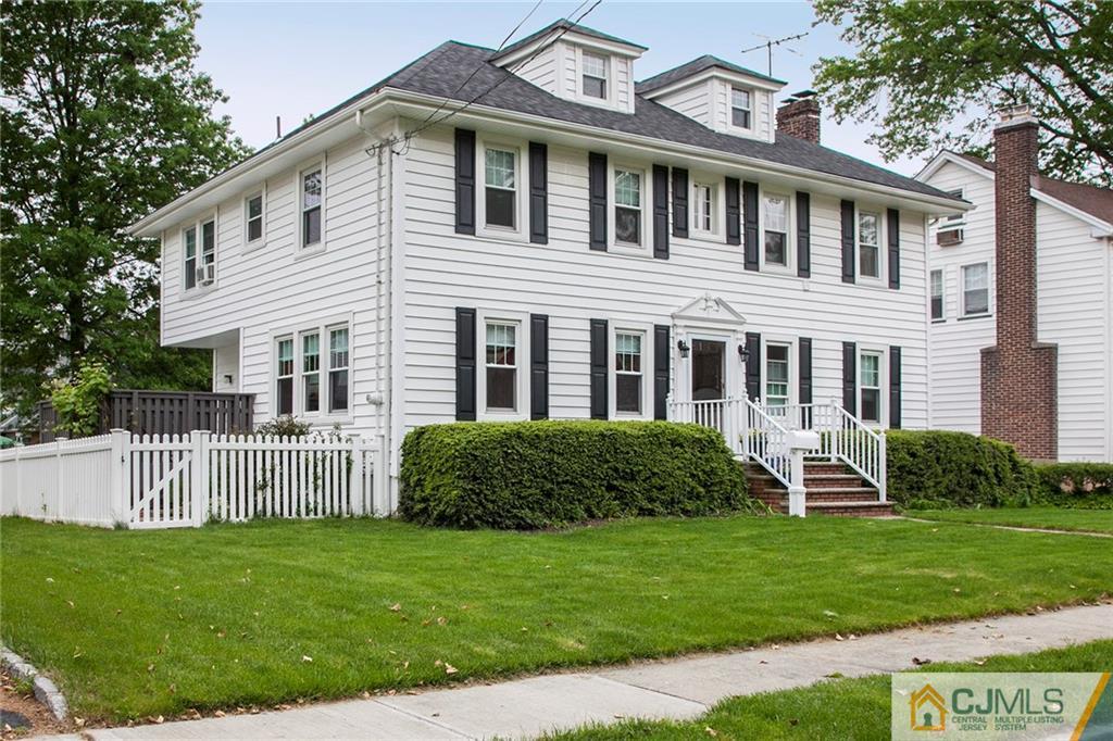 9 Lenox Street Edison, NJ 08817 - Photo 3 of 23 a front view of a house with a yard