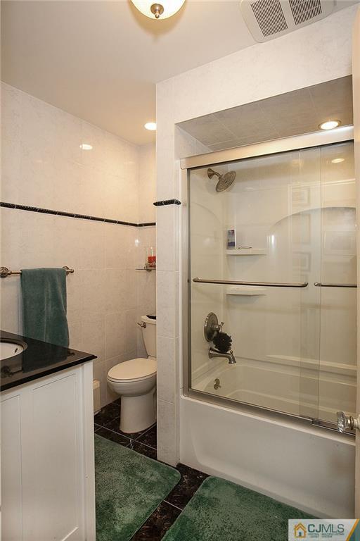 9 Lenox Street Edison, NJ 08817 - Photo 23 of 23 a bathroom with a toilet and a shower