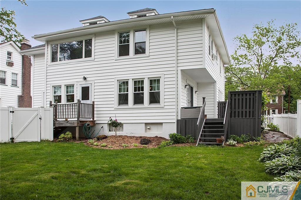 9 Lenox Street Edison, NJ 08817 - Photo 4 of 23 a house view with a garden space