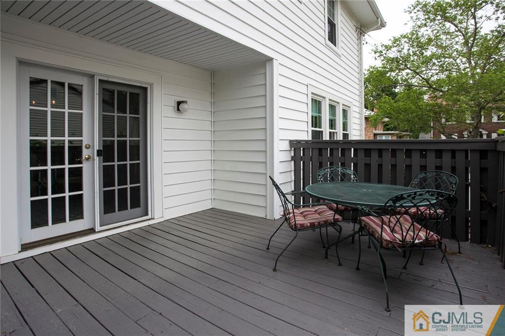 9 Lenox Street Edison, NJ 08817 - Photo 6 of 23 a view of a wooden chairs on the deck
