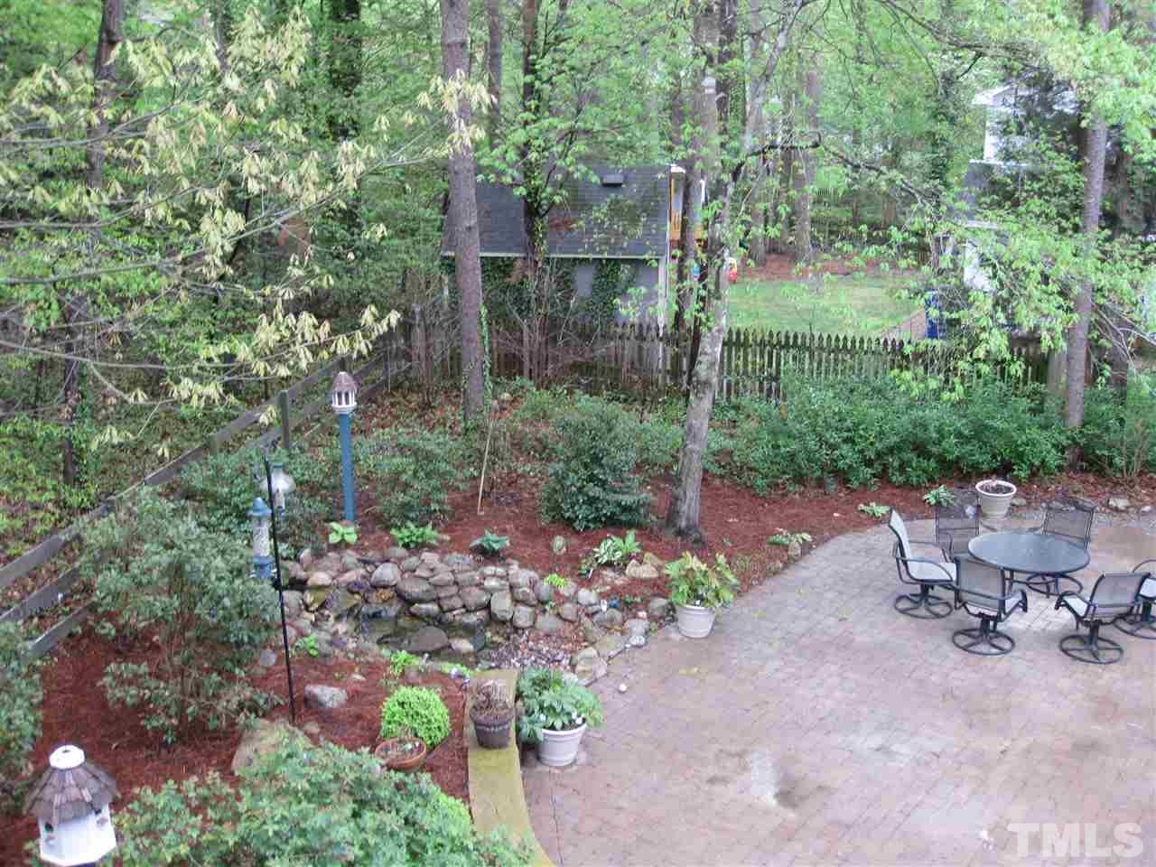 6523 Wynbrook Way Raleigh, NC 27612 - Photo 2 of 21 a view of a chair and table in the garden
