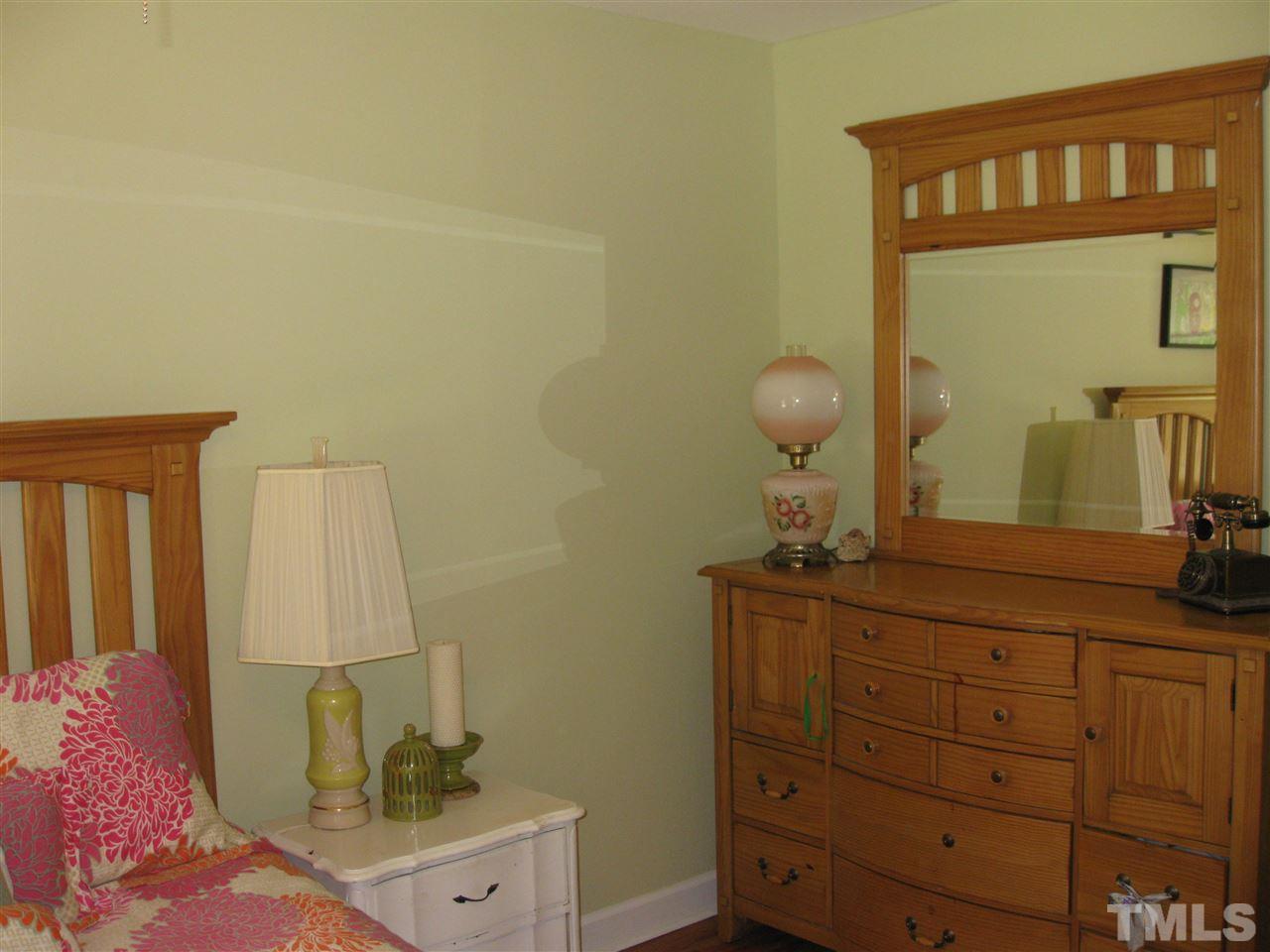 6523 Wynbrook Way Raleigh, NC 27612 - Photo 11 of 21 a bathroom with a sink and a mirror
