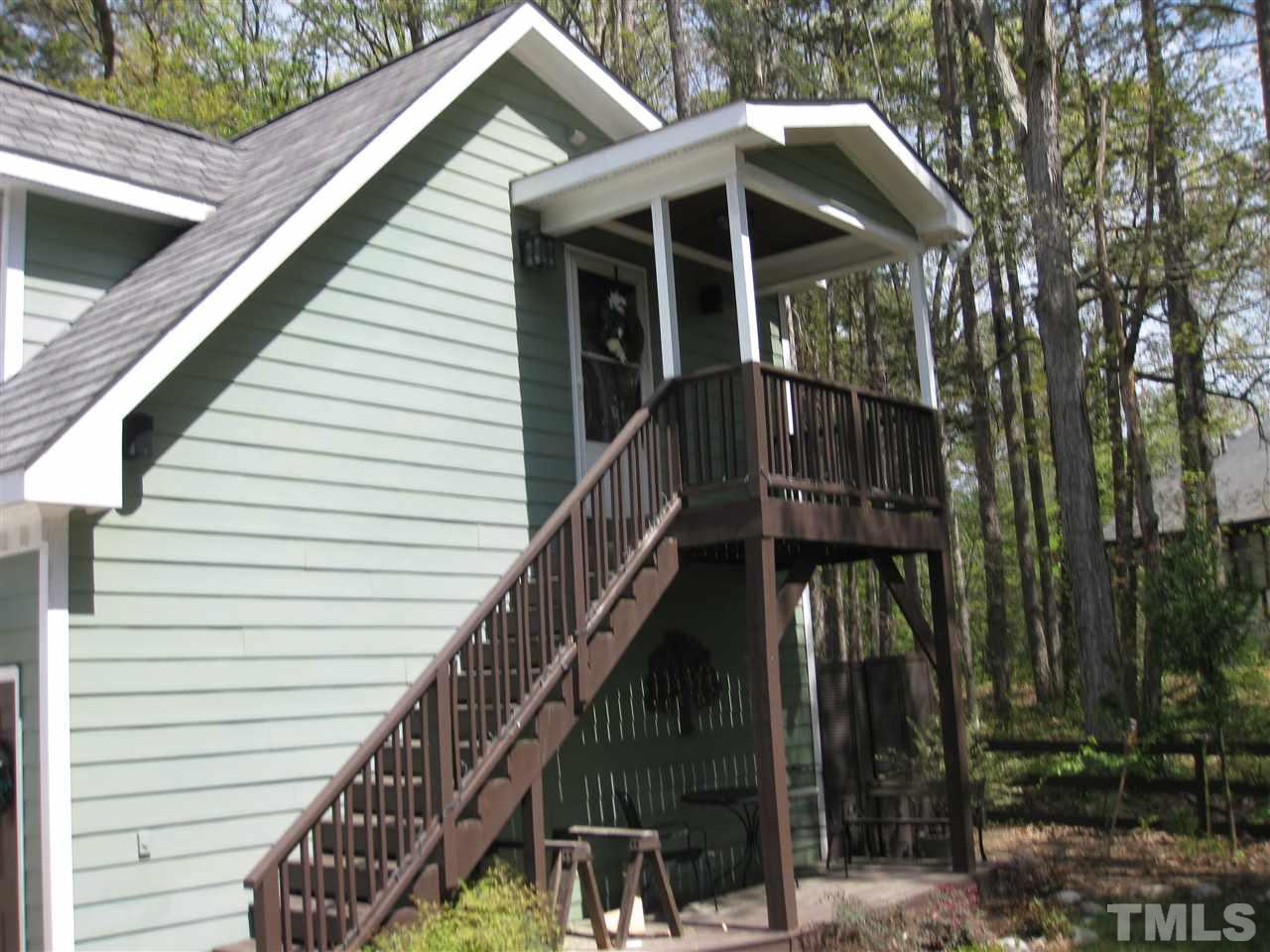 6523 Wynbrook Way Raleigh, NC 27612 - Photo 17 of 21 a view of wooden house with a small yard