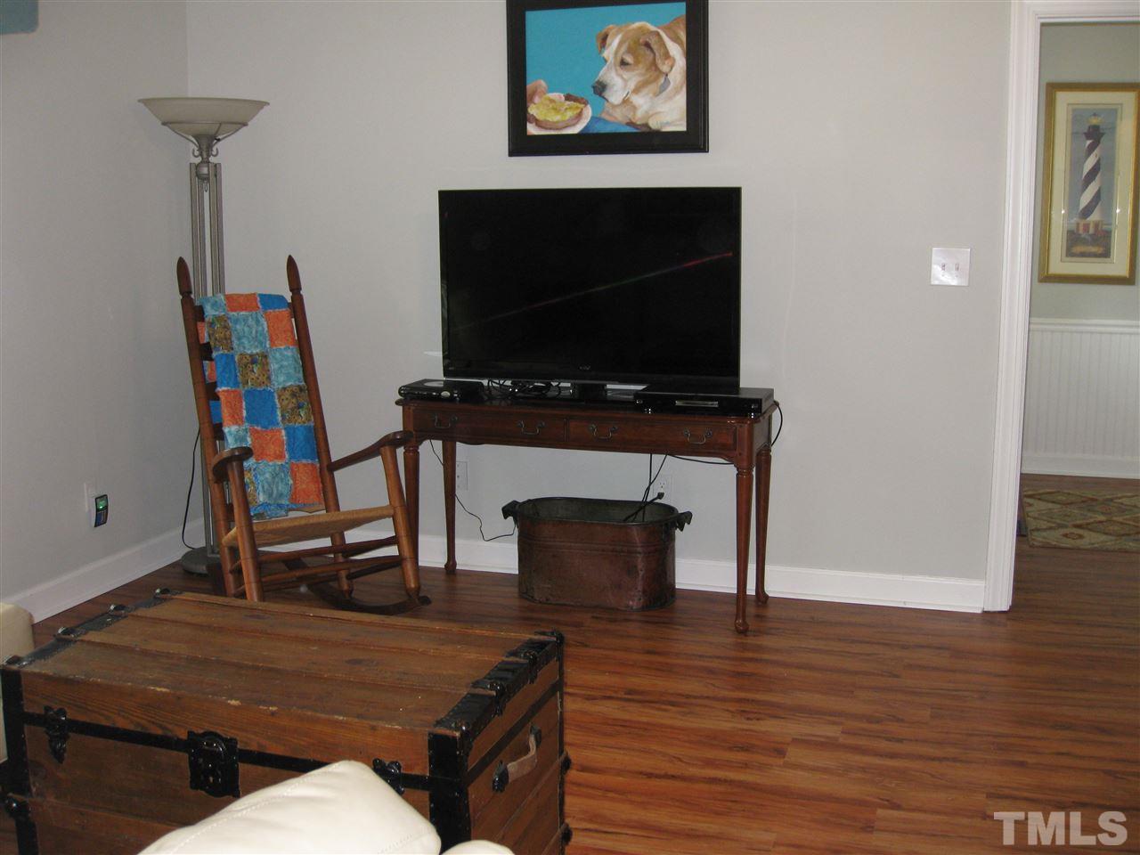 6523 Wynbrook Way Raleigh, NC 27612 - Photo 3 of 21 a living room with furniture and a fireplace