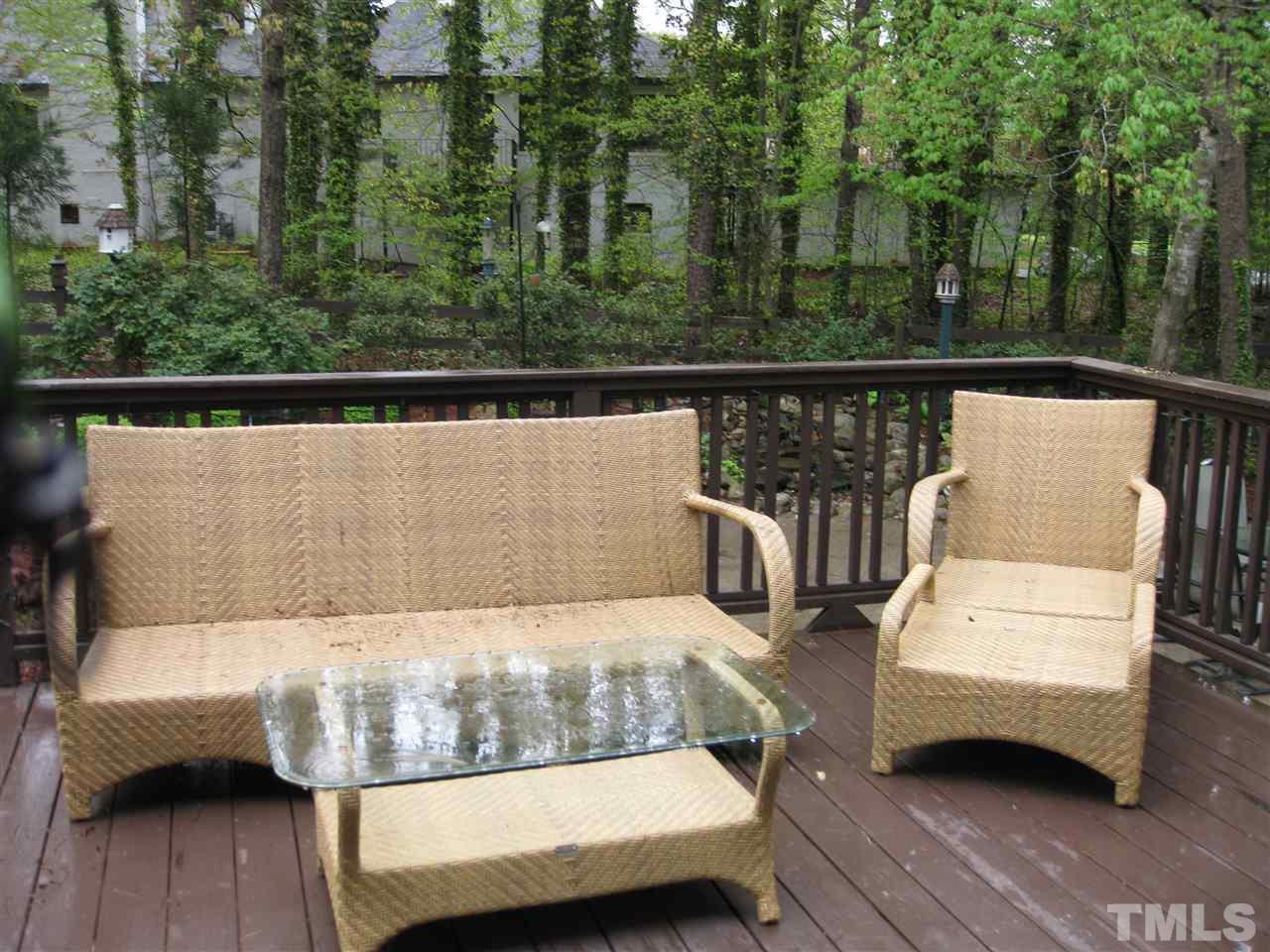 6523 Wynbrook Way Raleigh, NC 27612 - Photo 21 of 21 a view of a balcony with two couches and wooden floor