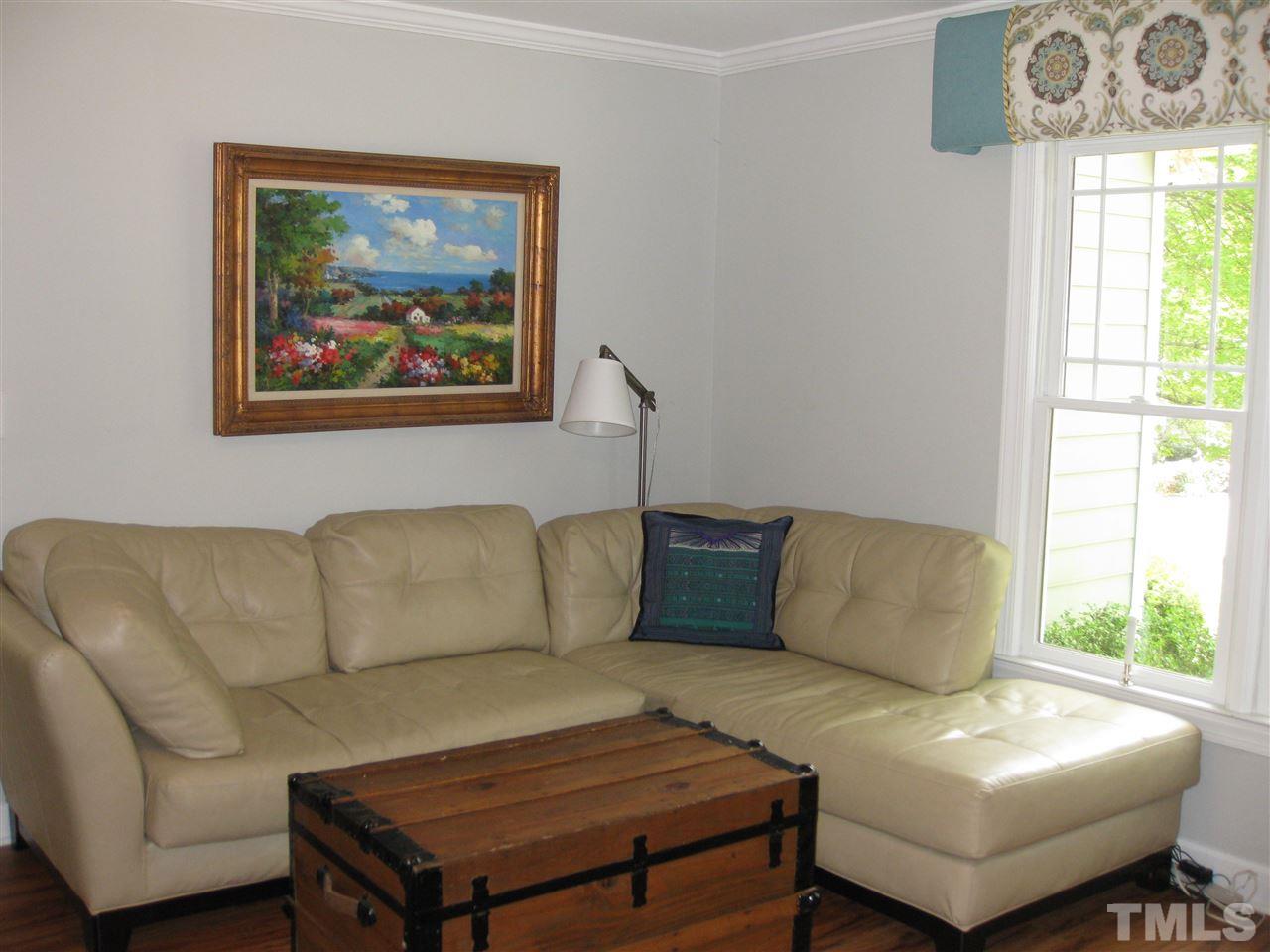 6523 Wynbrook Way Raleigh, NC 27612 - Photo 5 of 21 a living room with furniture a couch and a window