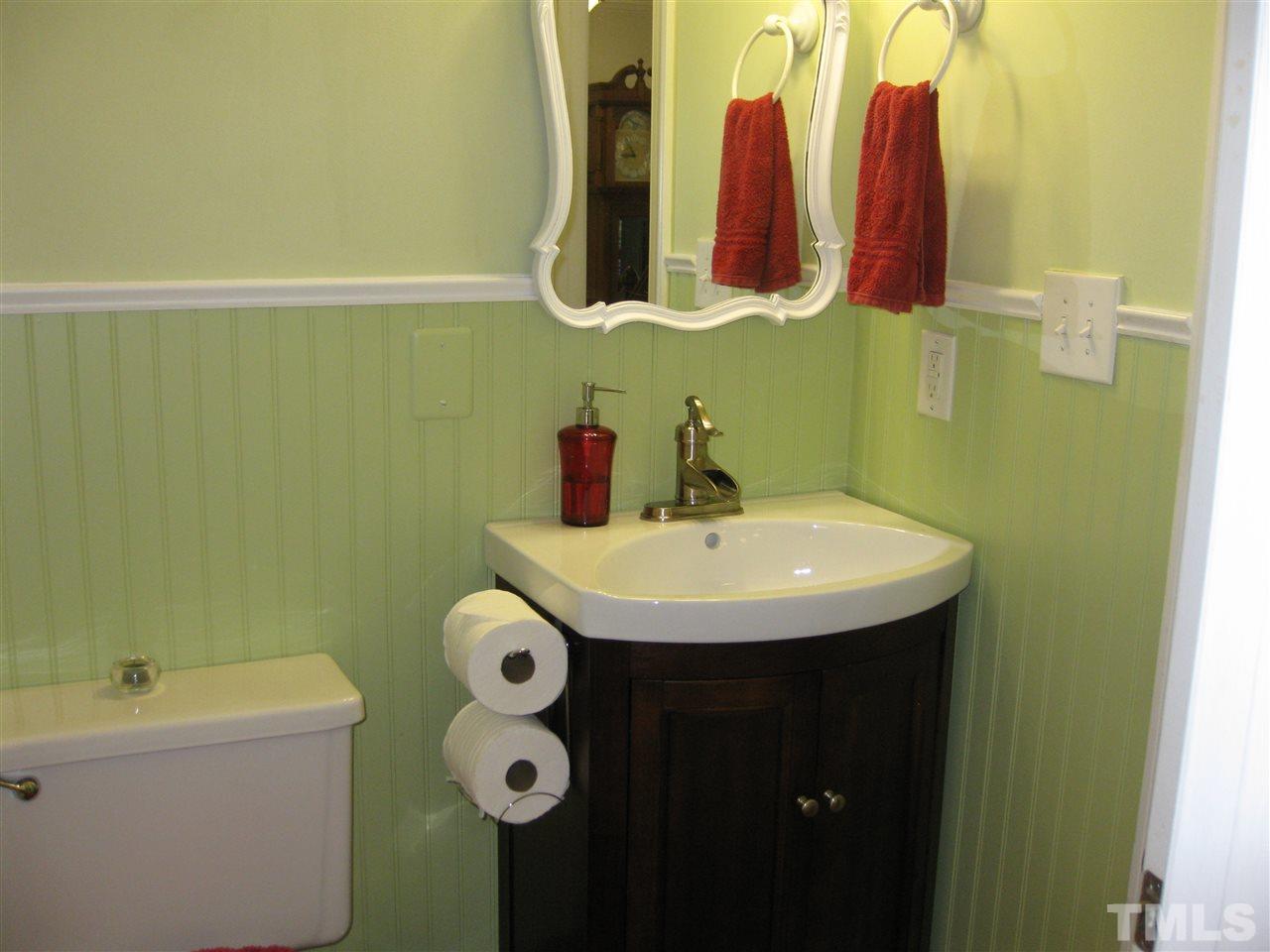 6523 Wynbrook Way Raleigh, NC 27612 - Photo 10 of 21 a bathroom with a sink and a mirror