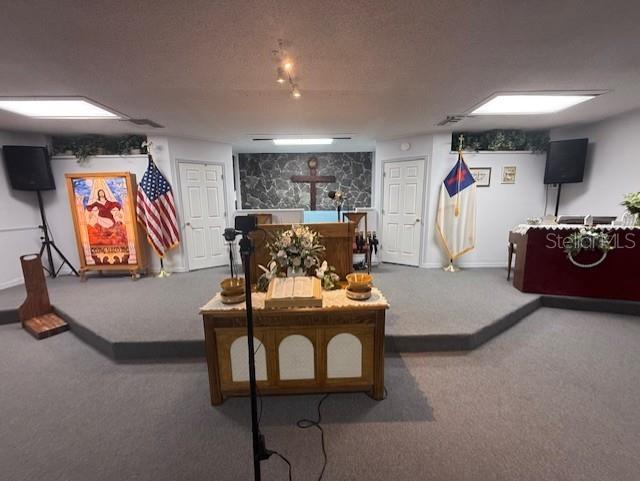 8826 Trevarthon Road Orlando, FL 32817 - Photo 12 of 57 a living room with furniture and a flat screen tv