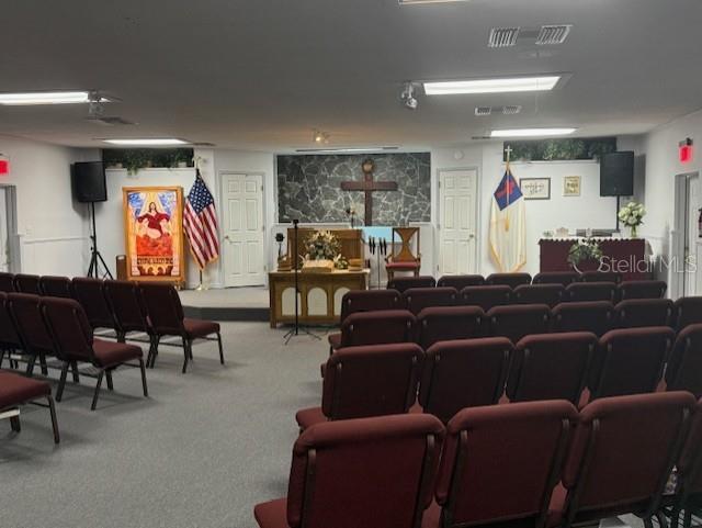 8826 Trevarthon Road Orlando, FL 32817 - Photo 16 of 57 a living room with furniture and a flat screen tv