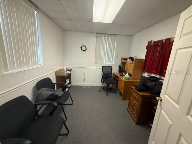 8826 Trevarthon Road Orlando, FL 32817 - Photo 17 of 57 a view of a workspace with furniture and a window