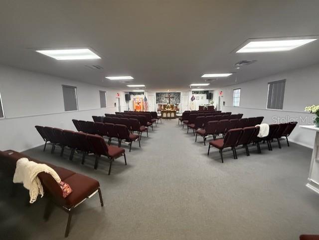 8826 Trevarthon Road Orlando, FL 32817 - Photo 19 of 57 a living room with furniture and a dining table