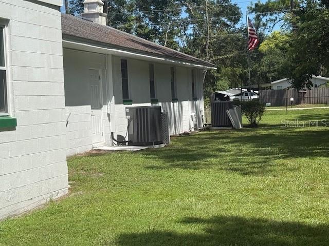 8826 Trevarthon Road Orlando, FL 32817 - Photo 22 of 57 a backyard of a house with table and chairs
