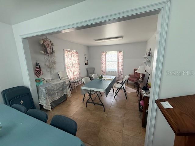 8826 Trevarthon Road Orlando, FL 32817 - Photo 25 of 57 a living room with furniture and a window