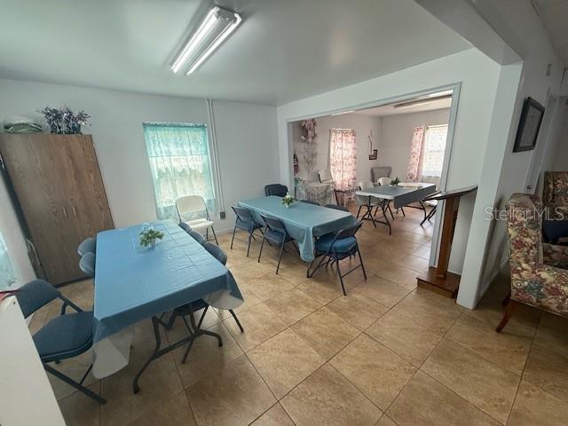 8826 Trevarthon Road Orlando, FL 32817 - Photo 27 of 57 a living room with furniture and a window
