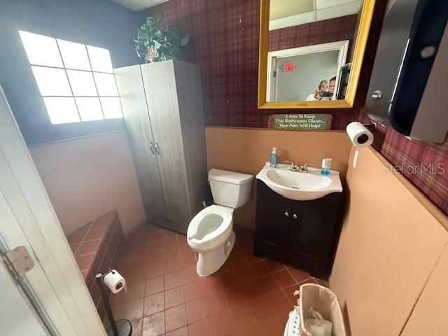 8826 Trevarthon Road Orlando, FL 32817 - Photo 28 of 57 a bathroom with a sink and a mirror