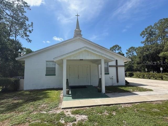 8826 Trevarthon Road Orlando, FL 32817 - Photo 3 of 57 a view of a house with backyard and garden