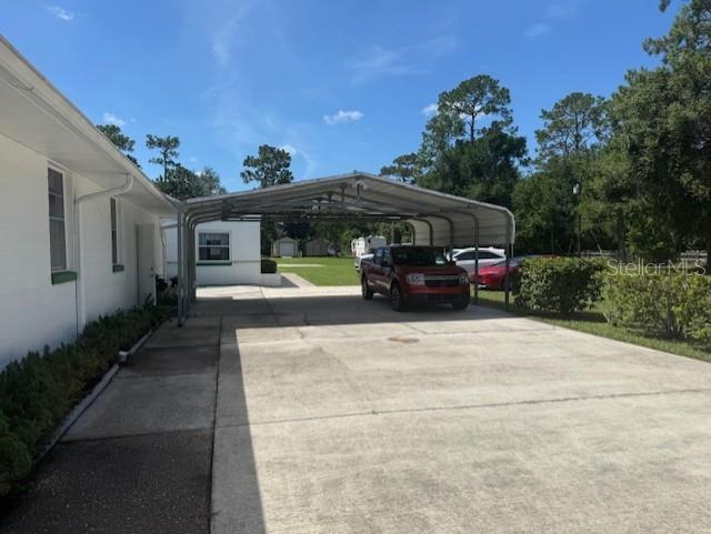 8826 Trevarthon Road Orlando, FL 32817 - Photo 32 of 57 a car parked in front of a house