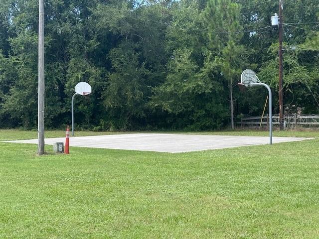 8826 Trevarthon Road Orlando, FL 32817 - Photo 33 of 57 a view of a house with a backyard and a swimming pool