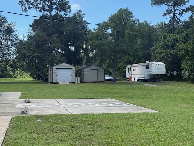 8826 Trevarthon Road Orlando, FL 32817 - Photo 34 of 57 a front view of a house with garden