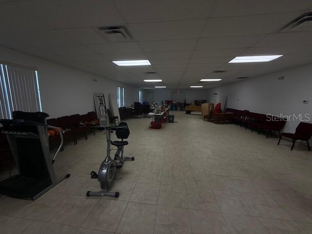 8826 Trevarthon Road Orlando, FL 32817 - Photo 40 of 57 a view of a room with gym equipment