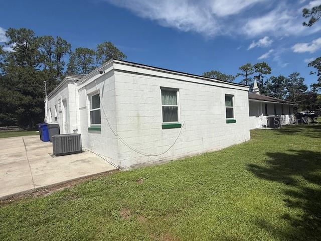 8826 Trevarthon Road Orlando, FL 32817 - Photo 4 of 57 a view of a house with a yard