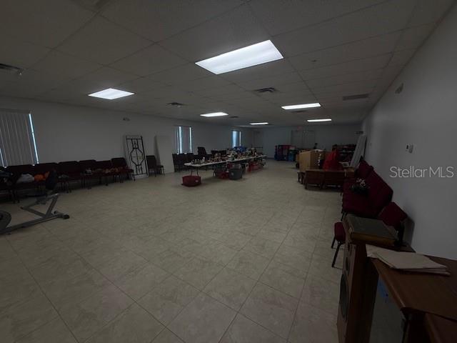 8826 Trevarthon Road Orlando, FL 32817 - Photo 43 of 57 a view of a room with gym equipment and a large window