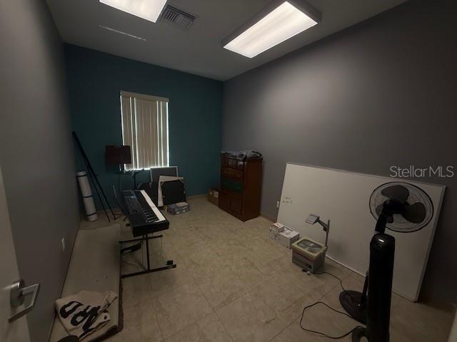 8826 Trevarthon Road Orlando, FL 32817 - Photo 44 of 57 a view of a room with gym equipment