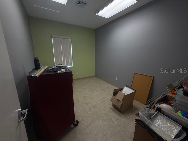 8826 Trevarthon Road Orlando, FL 32817 - Photo 46 of 57 a room with furniture and gym equipment