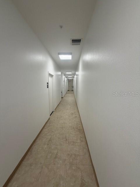8826 Trevarthon Road Orlando, FL 32817 - Photo 53 of 57 a view of a hallway