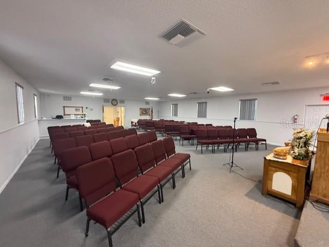 8826 Trevarthon Road Orlando, FL 32817 - Photo 7 of 57 a living room with lots of furniture and a dining table with wooden floor