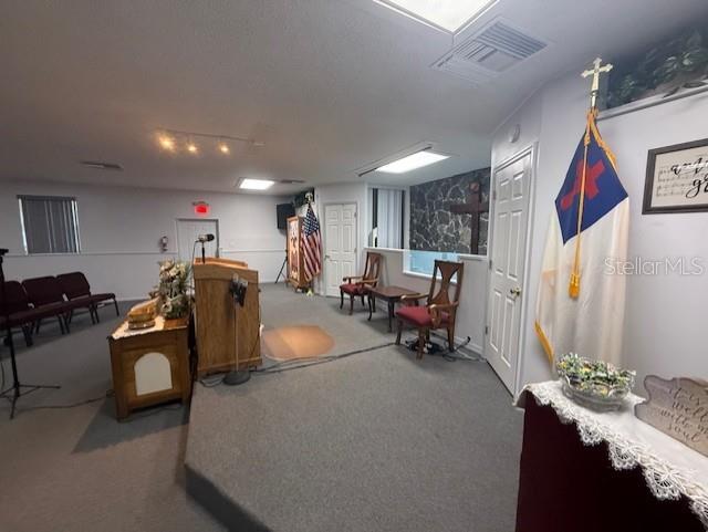 8826 Trevarthon Road Orlando, FL 32817 - Photo 8 of 57 a living room with furniture and a mirror