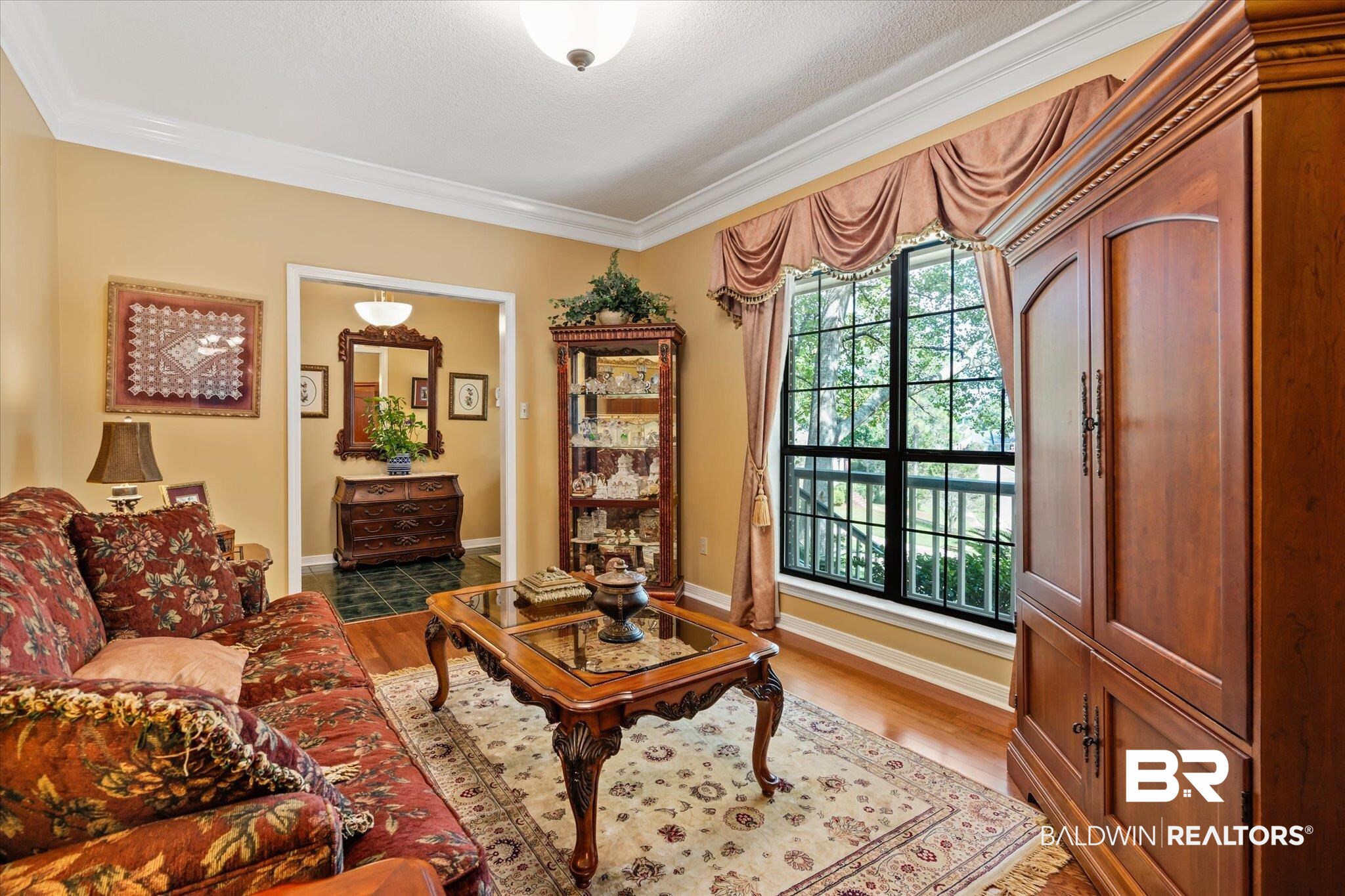 7360 Bridgewood Court Mobile, AL 36695 - Photo 5 of 30 Living room featuring ornamental molding and wood-type flooring