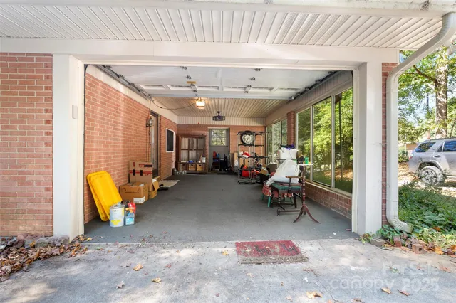 a view of a backyard with large trees