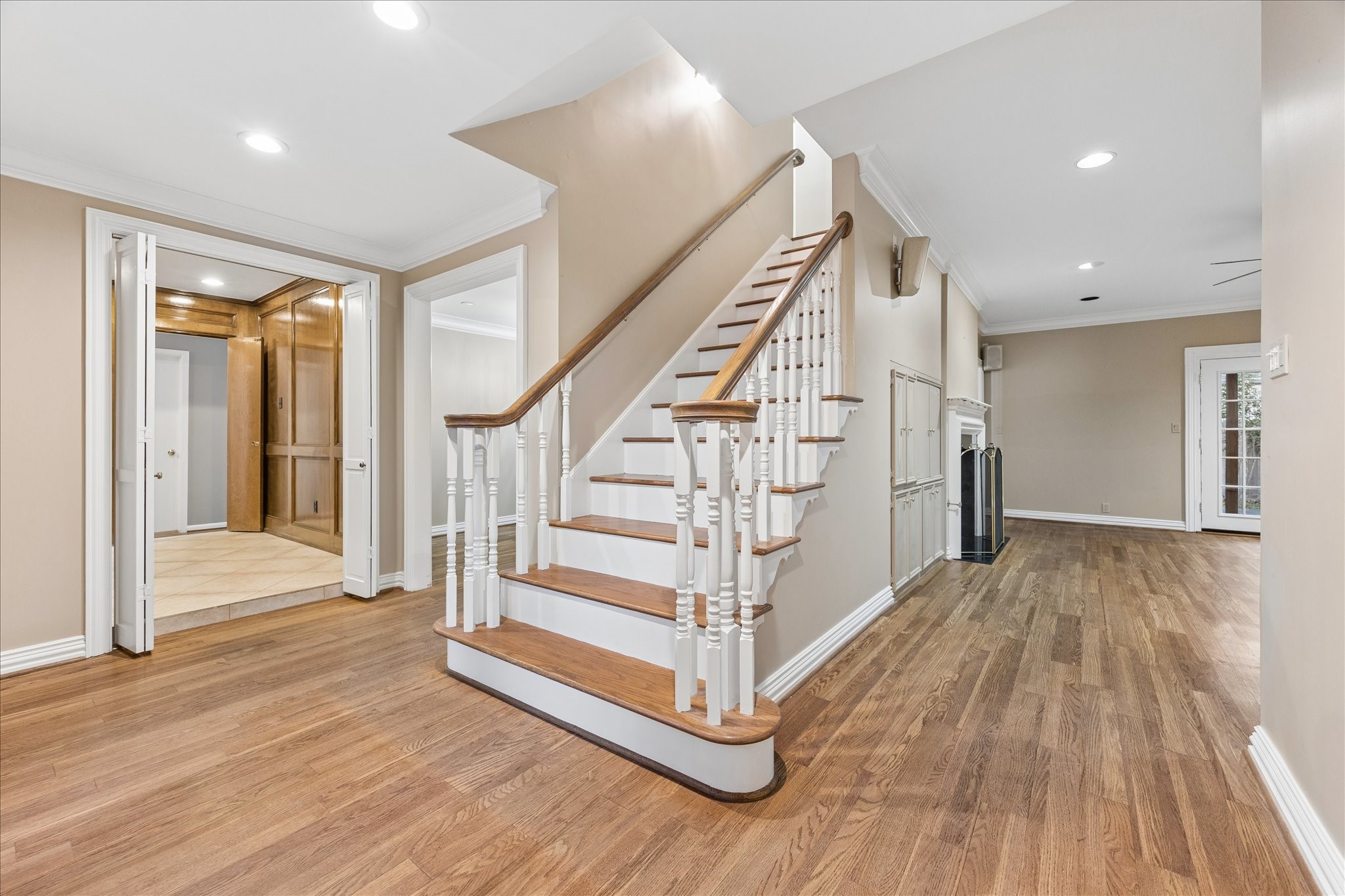636 Rancho Bauer Drive Houston, TX 77079 - Photo 9 of 42 Stairway in the entry hall with a view into the study on the left and the living area on the right. All hardwood floors have been cleaned and polished throughout.