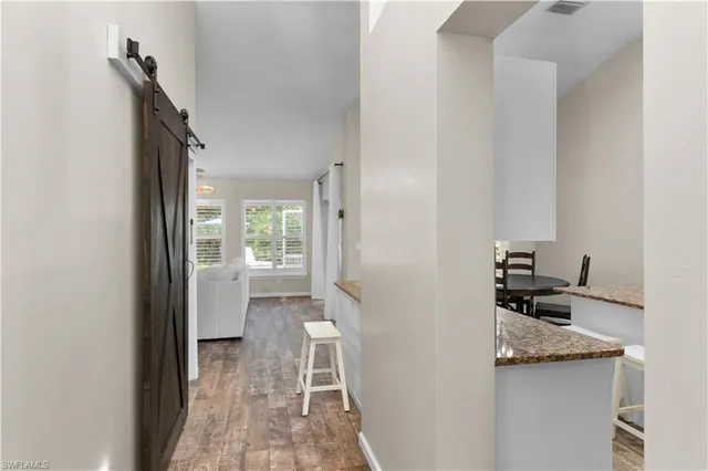 a kitchen with granite countertop a sink and a stove top oven