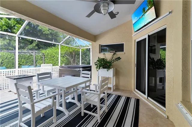a view of a patio with table and chairs