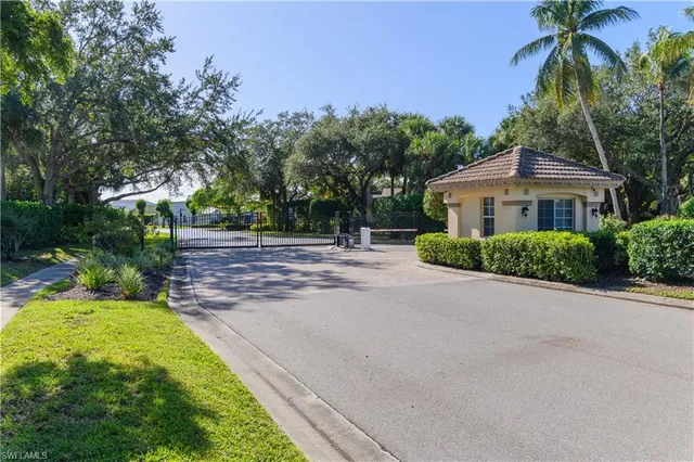 a house with palm tree in front of it
