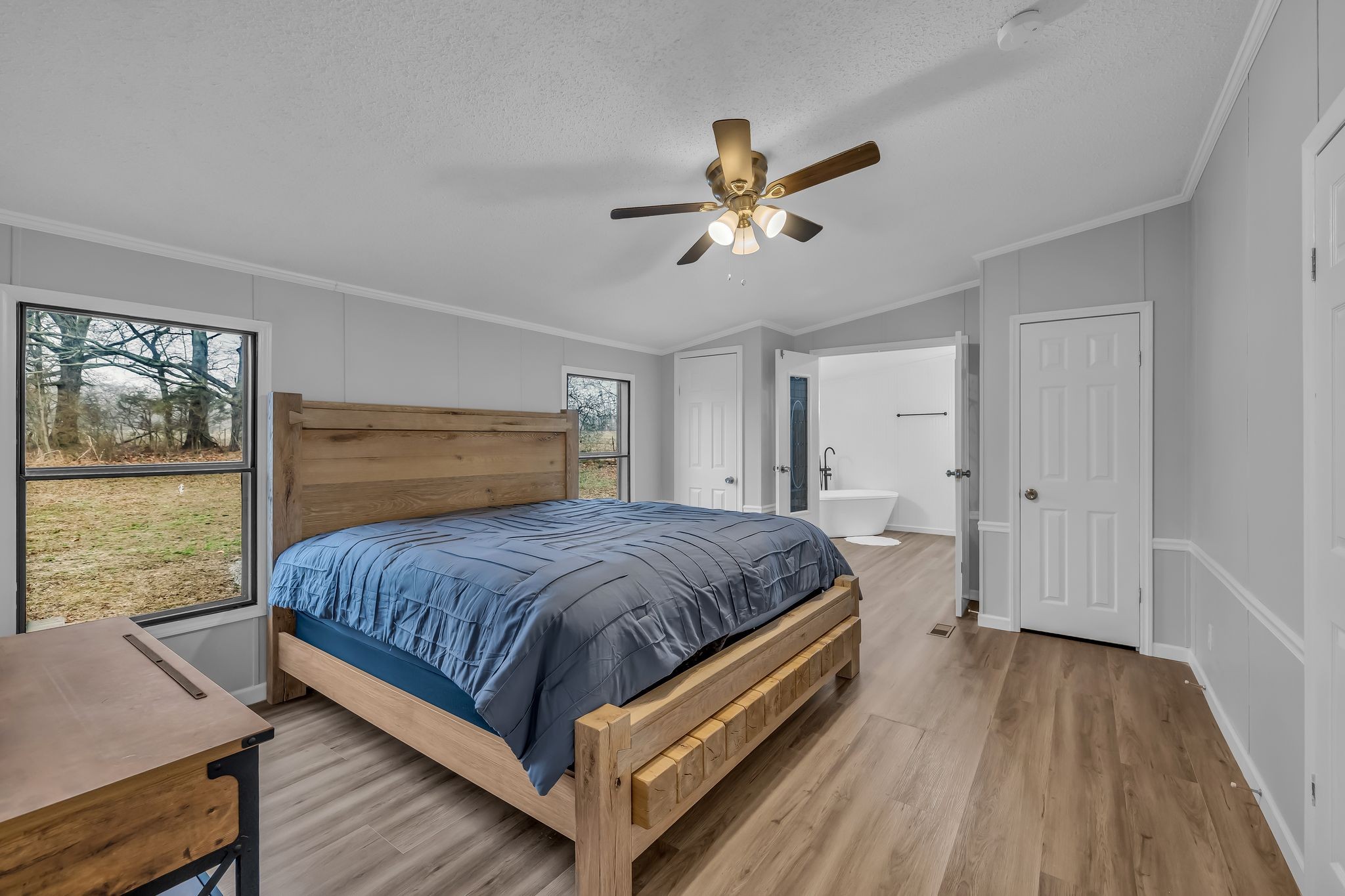 830 Calls Road Estill Springs, TN 37330 - Photo 13 of 35 a bedroom with a bed and large window