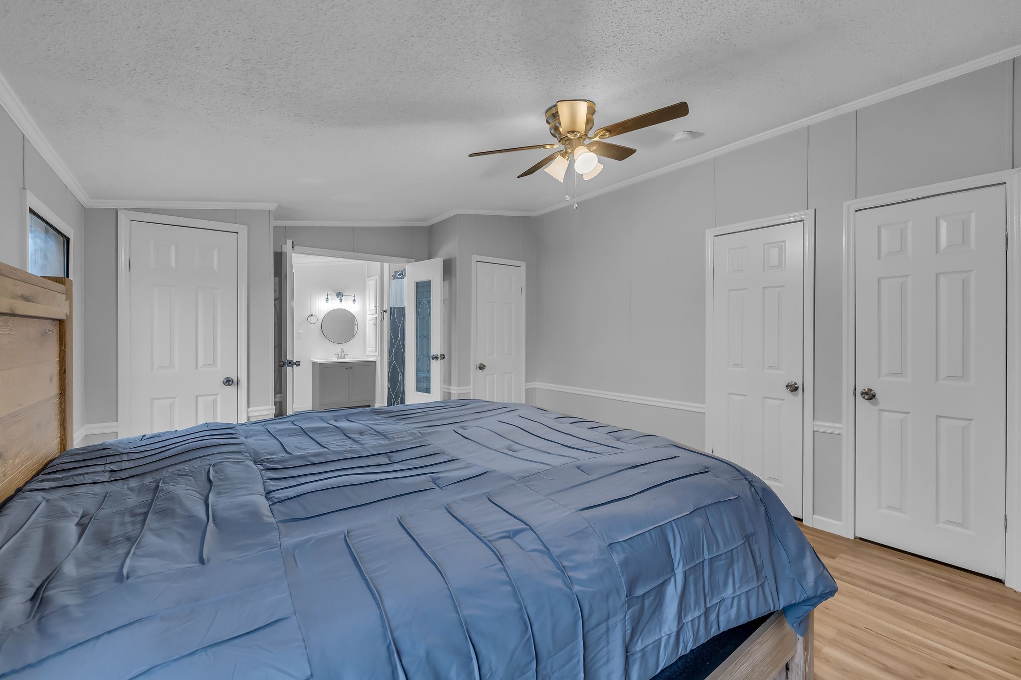830 Calls Road Estill Springs, TN 37330 - Photo 14 of 35 a bedroom with a bed and a chandelier